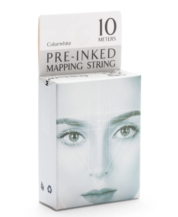 A box of pre-inked mapping string for eyebrow technical drawing, predominantly white in color with a close-up of a female face, and text indicating a 10-meter length.