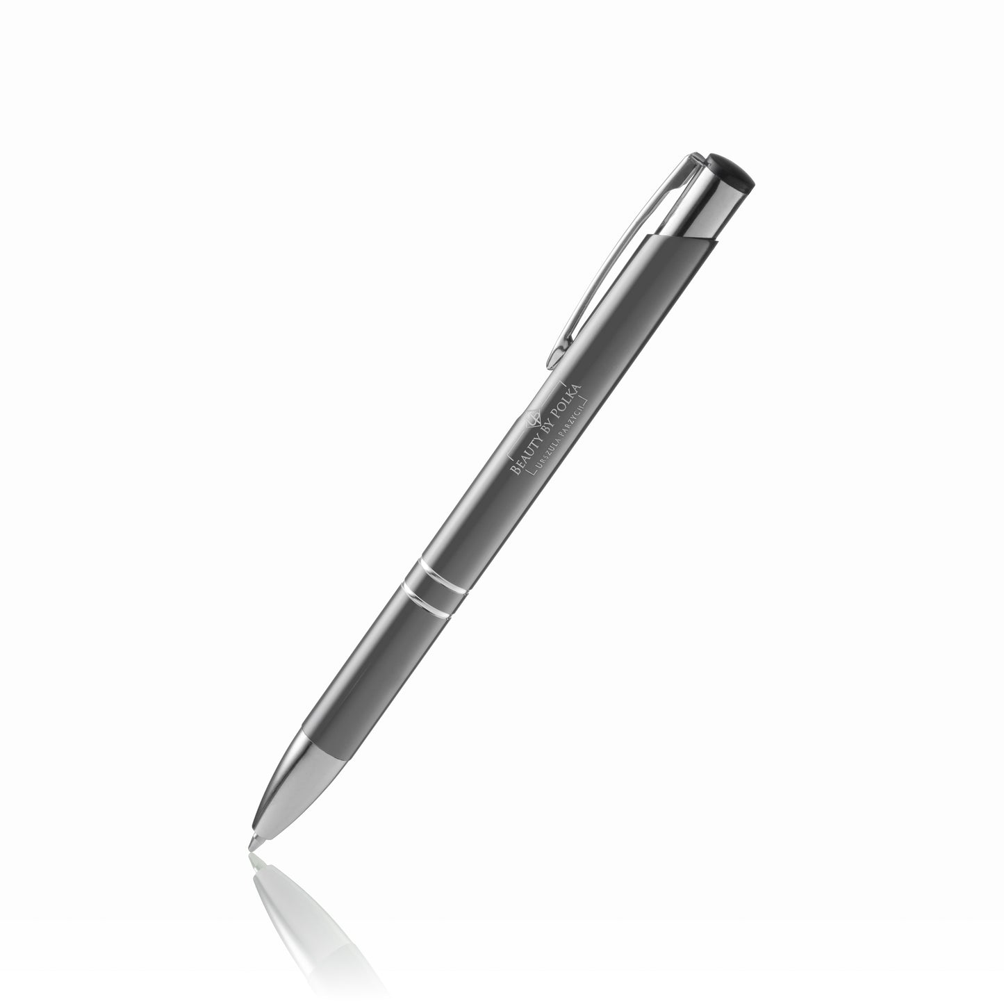 An engraved metal pen with a black lacquered coating, silver accents, and a metal clip. The pen's model name is 'Beauty by Polka'.