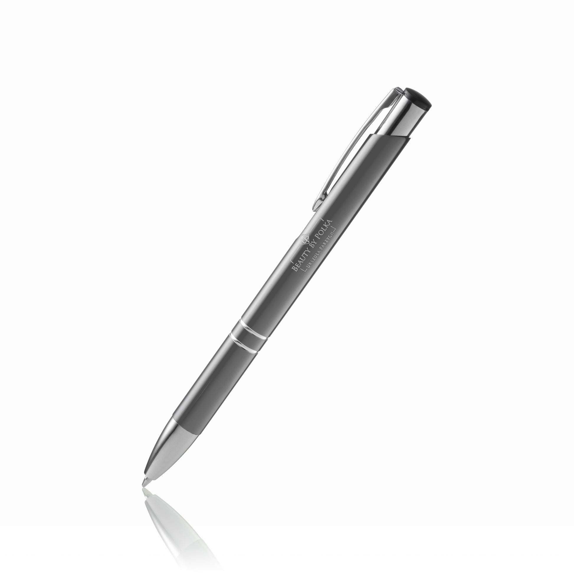 An engraved metal pen with a black lacquered coating, silver accents, and a metal clip. The pen's model name is 'Beauty by Polka'.