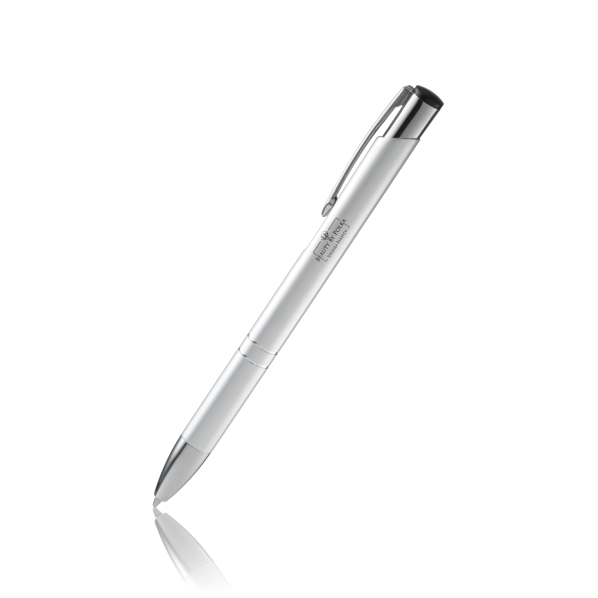 An engraved metal pen with a silver lacquered coating, silver accents, and a metal clip. The pen's model name is 'Beauty by Polka'.