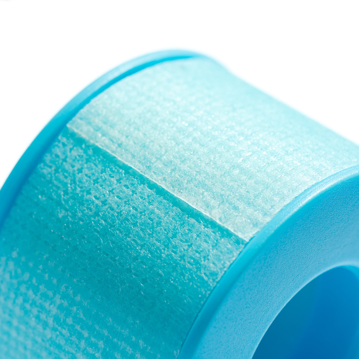 Close-up of 3M silicone tape roll used for eyelash extension procedures.