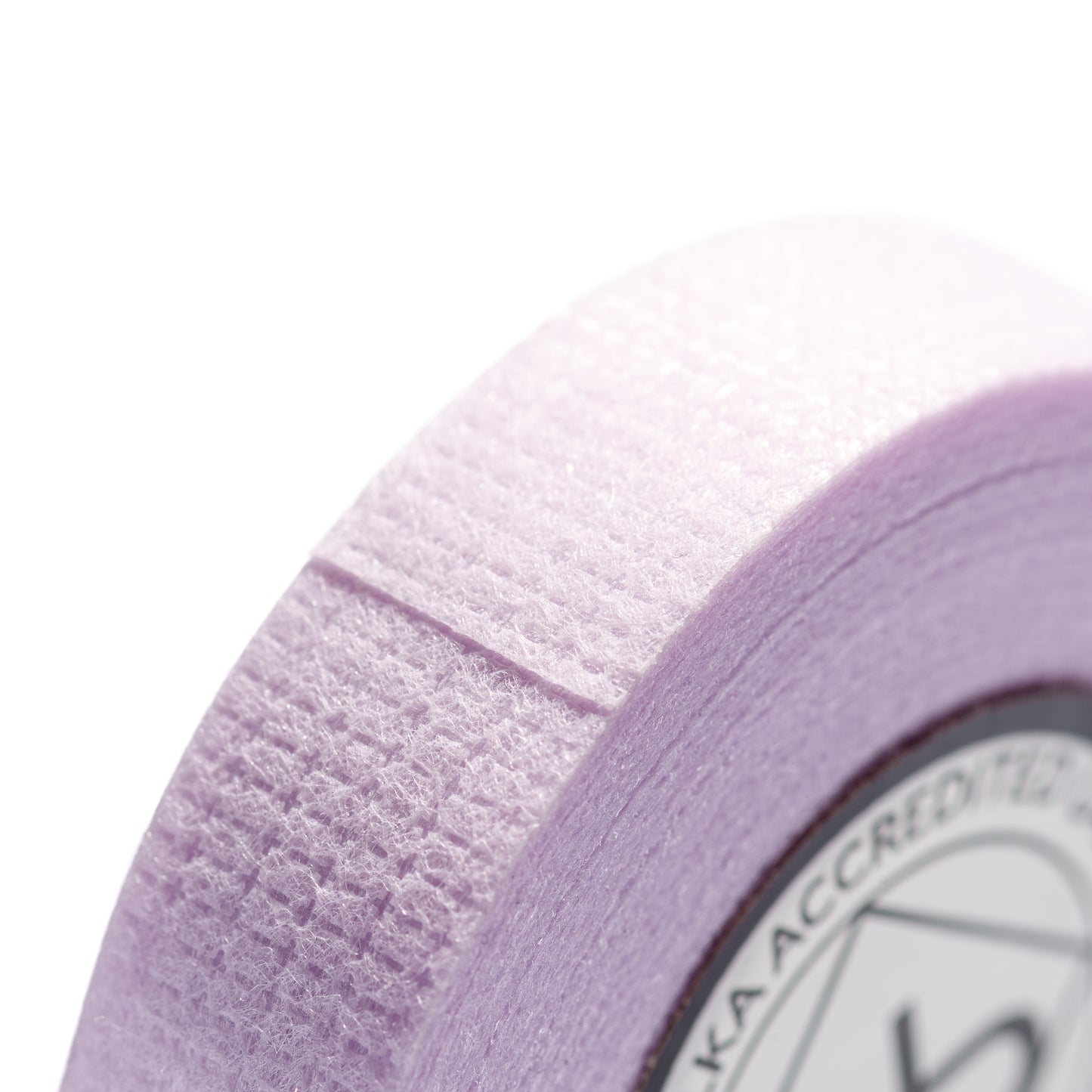 Roll of purple perforated tape for use in lash extension salons