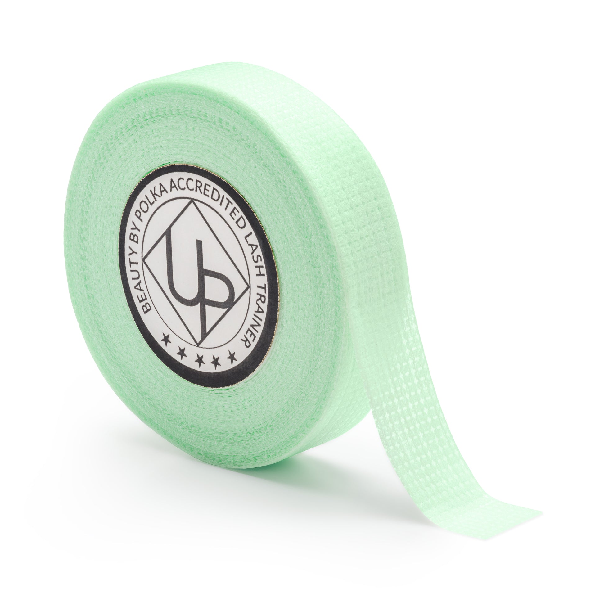 Perforated green tape for securing lower lashes during eyelash treatments.