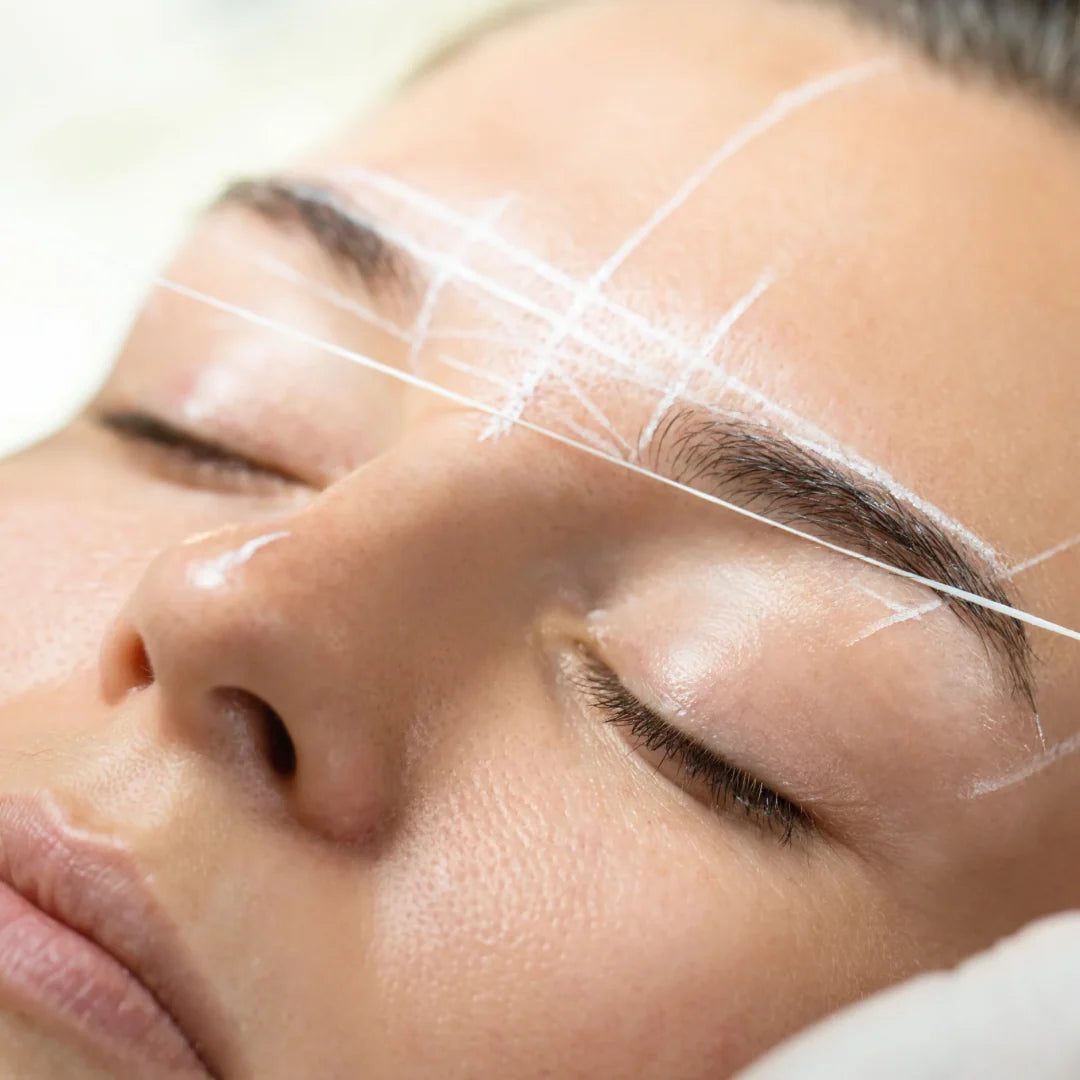 Beauty training focused on eyebrow geometry on model
