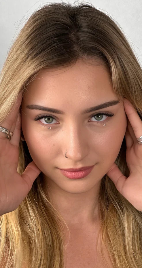 Beauty shot of model with styled eyebrows and enhanced eyelashes
